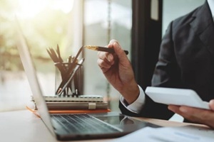 accountant working with computer tablet in modern office, preparing accounting analysis report