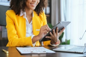 african american business woman working audit balance sheet