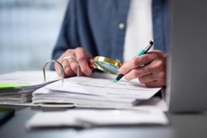 auditor using magnifying glass for audit