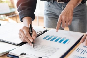 business people meeting to analyse and discuss and brainstorming the financial report chart data in office