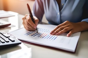 business women checking annual graph