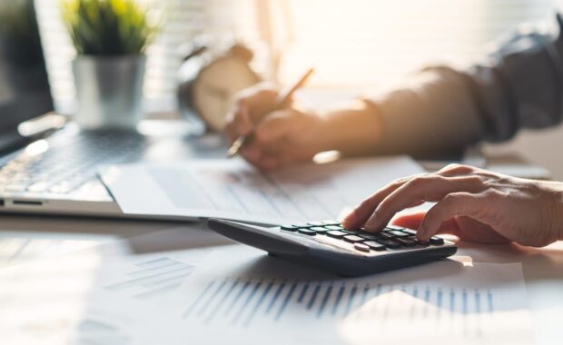 businessman calculating business balance prepare tax reduction