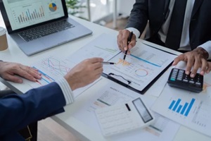 businessman discussing commercial real estate sector faces risks as financial