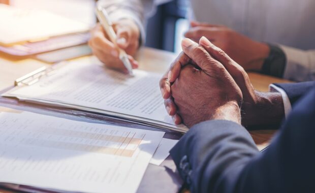 businessman reading documents at meeting