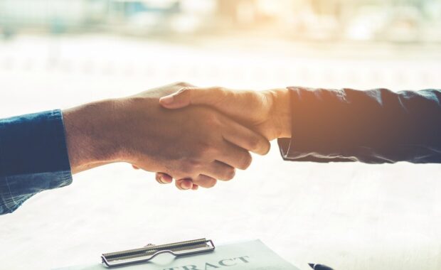 businessman signing a document
