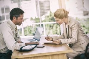 businesswoman signing contract at interview
