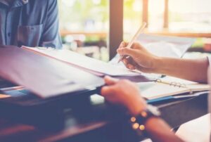close up of Businessman's hands sign in contract on desk