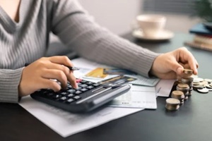 finance bank tax expense accounting budget money businessman hand use calculator