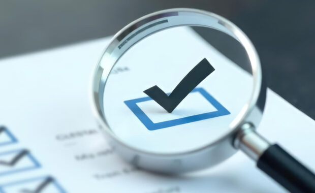 magnifying glass and check mark icon