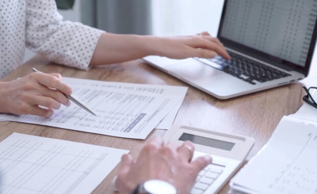 professional female bookkeeper or auditor are working on business finances with a colleague