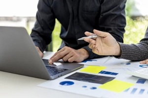 salespeople are working together to prepare a company sales report to bring to the monthly general meeting with the management