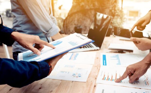 young asian developers working in their start-up home office with brainstorming
